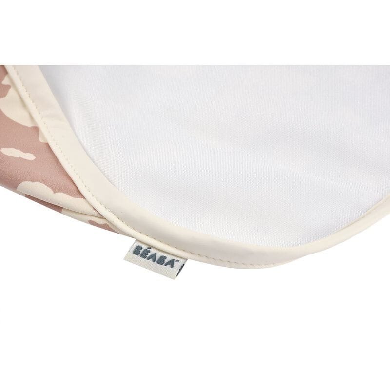 Bavoir Béaba "Savannah Bloom" à manches longues et détachables, poche récupératrice, réglable 3 tailles, imperméable, utilisable jusqu’à 4 ans, entretien facile.