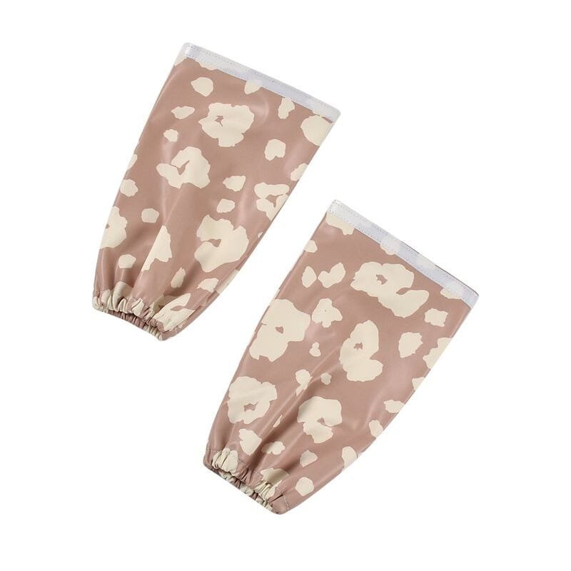 Bavoir Béaba "Savannah Bloom" à manches longues et détachables, poche récupératrice, réglable 3 tailles, imperméable, utilisable jusqu’à 4 ans, entretien facile.